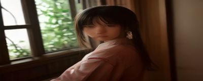 四色宣传册印刷设计稿与成品对比，设计师手持色卡在印刷成品旁比对颜色，专业印前检查场景
